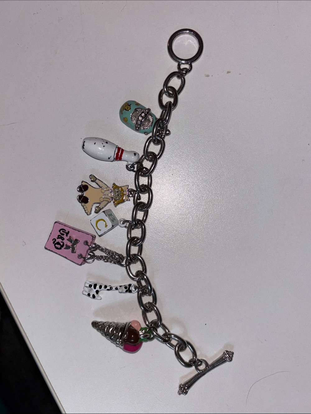 Juicy Couture Silver Charm Bracelet with Pink and Gold Accents
